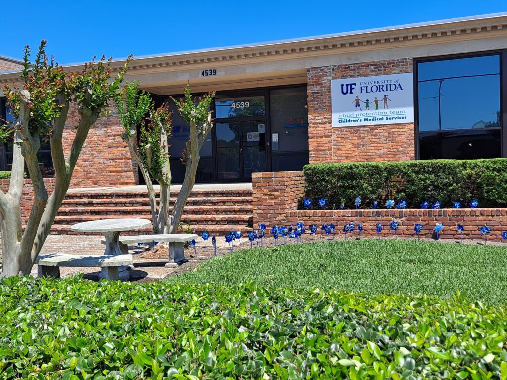 CPT building, 4539 Beach Boulevard, Jacksonville, FL 32207, with pinwheels in front representing National Child Abuse Prevention Month - April.